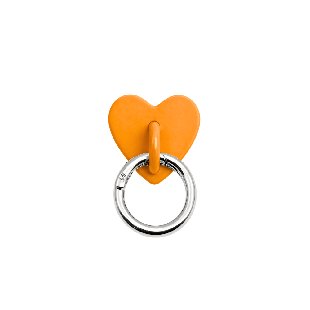 orange heart shaped adapter to hang charms on phone case
