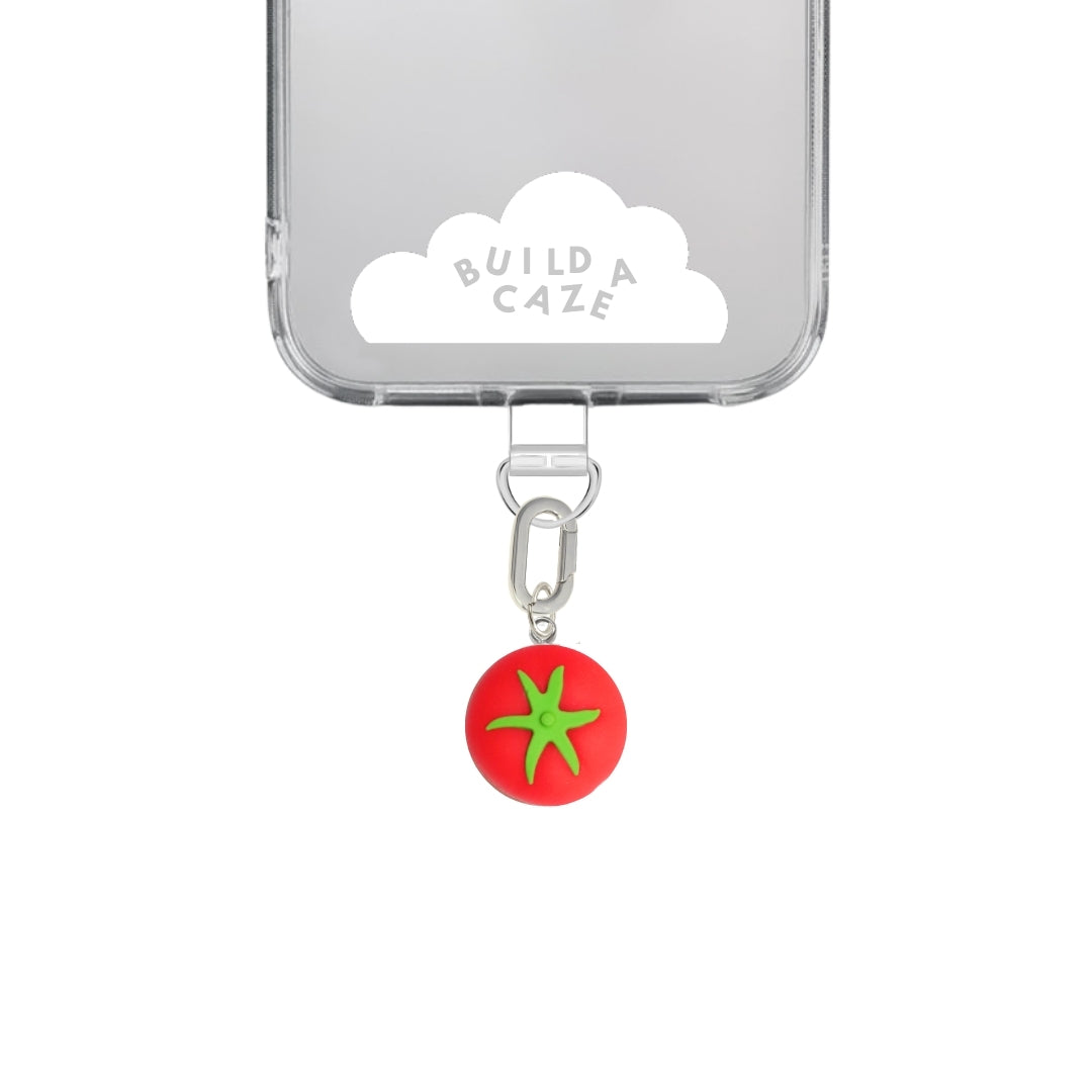 Adorable 3D red tomato phone charm with a round vegetable design, quirky food-themed mobile accessory and Y2K aesthetic tech decoration for phone cases by Build a Caze.