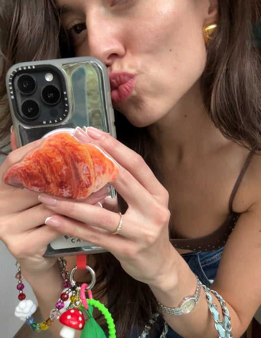 Realistic croissant pastry magsafe pop holder, cute magnetic pop socket and phone grip accessory.