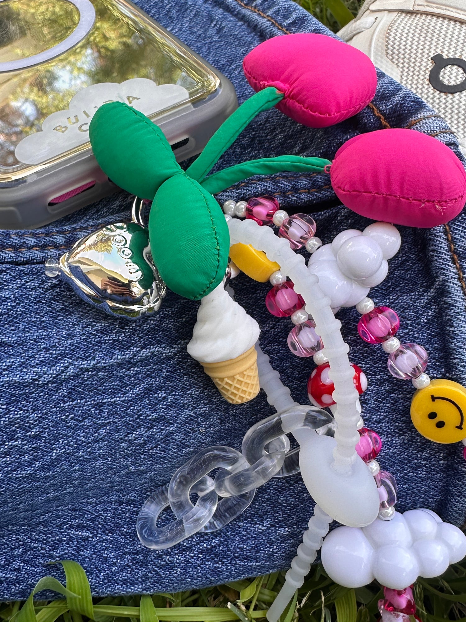 Playful Sunday Funday phone charm with a colorful and vibrant design, trendy Y2K aesthetic mobile accessory and decorative strap for phone cases by Build a Caze.