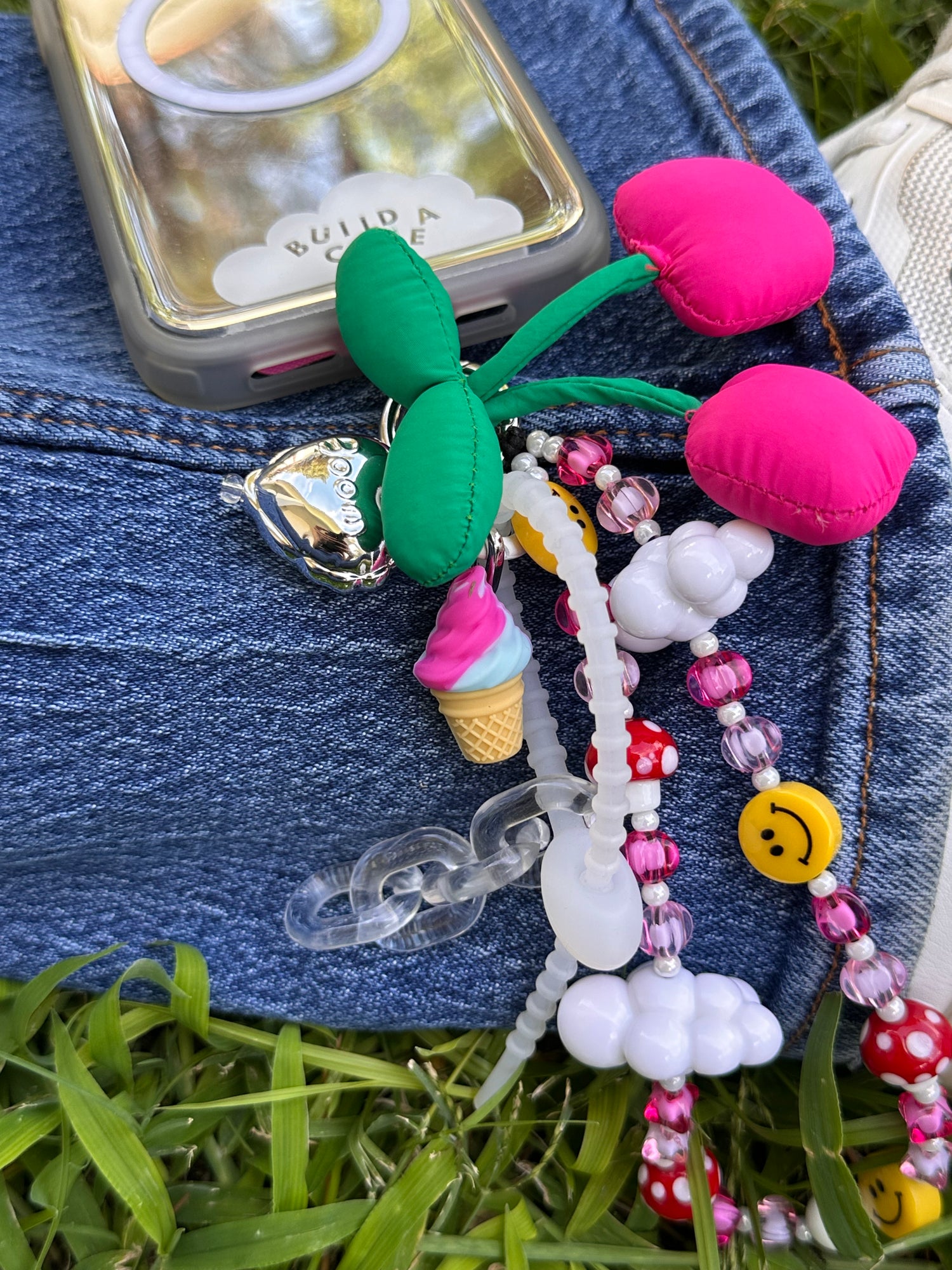 Cute swirly ice cream sundae phone charm, nostalgic Y2K aesthetic dessert-themed mobile accessory and decorative case strap by Build a Caze.
