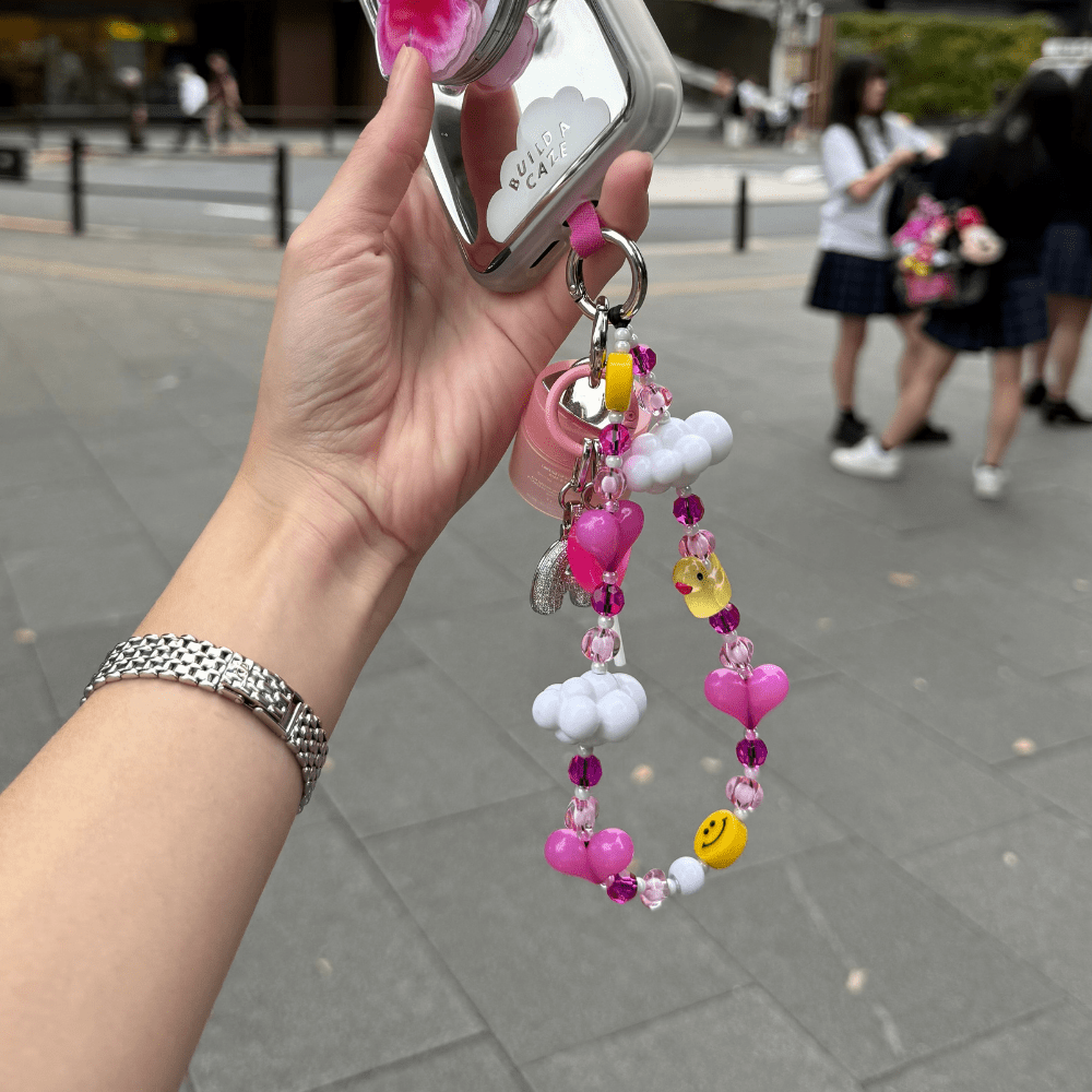 Phone lanyard bright pink hearts, sparkly beads, white clouds, and happy yellow duck and smiley face beaded Build A Caze