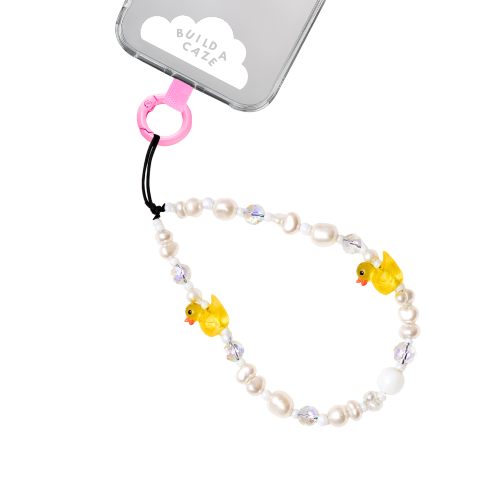 White pearl beaded phone strap featuring two yellow duck charms and sparkling crystal beads.