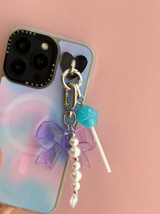 Blue and white Blueberry Pop Charmie charm and dangly accessory shown from a close-up angle - Build A Caze