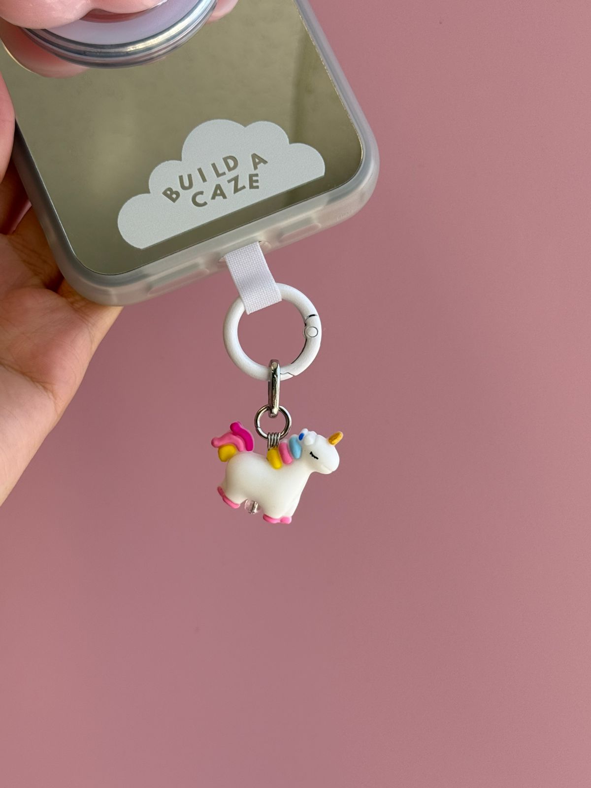 Pink and white Candy Uni Spark Charmie charm and dangly accessory shown against a plain background - Build A Caze