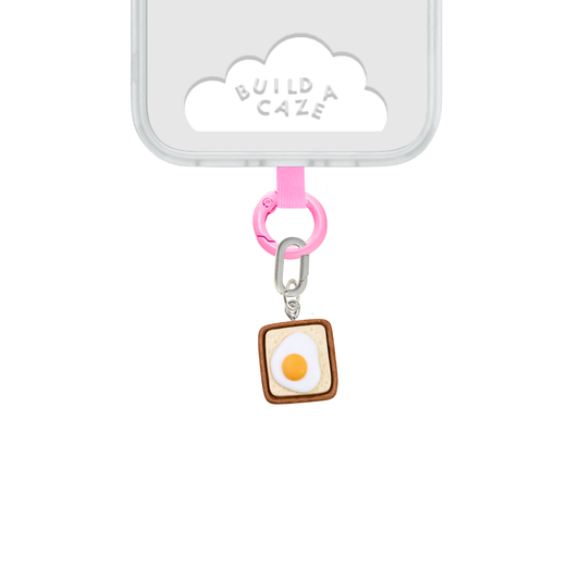 White and brown Eggie Toast Bites Charmie charm and dangly accessory shown against a plain background - Build A Caze