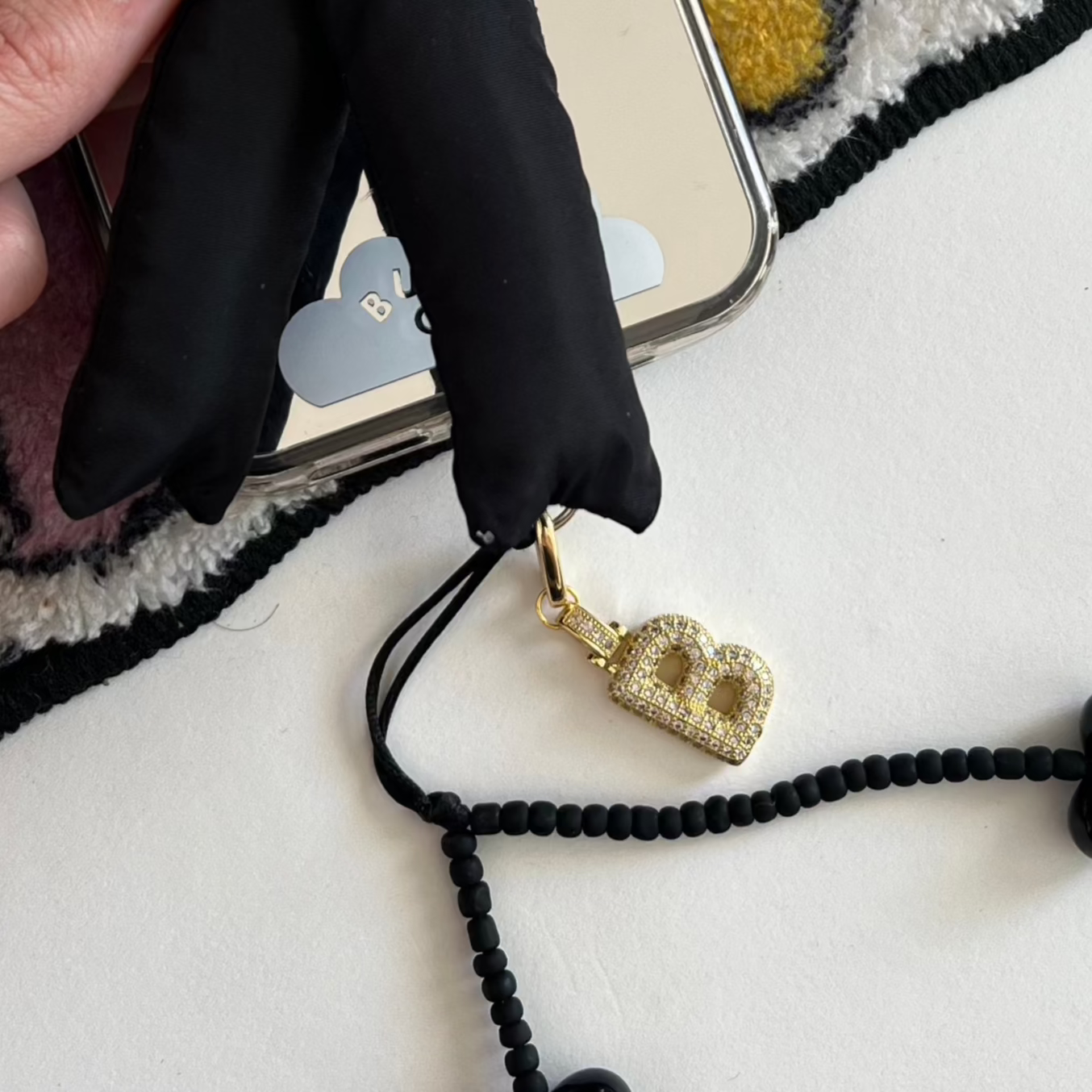 Silver chunky initial charm featuring the letter D, a trendy Y2K aesthetic phone case accessory and personalized jewelry-style mobile strap by Build a Caze.