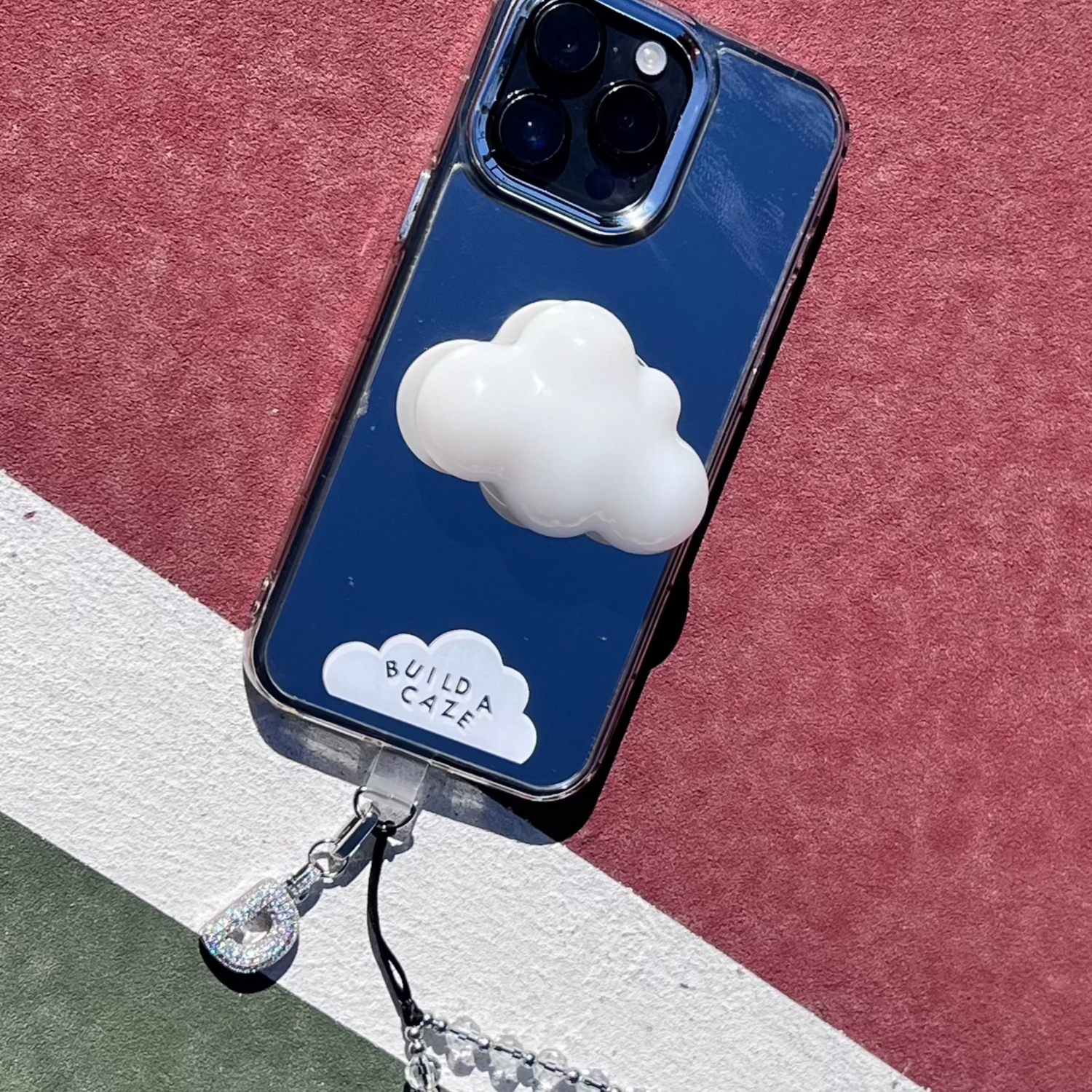 Head in the Clouds dreamscape design phone charm, ethereal cloud pattern MagSafe accessory.