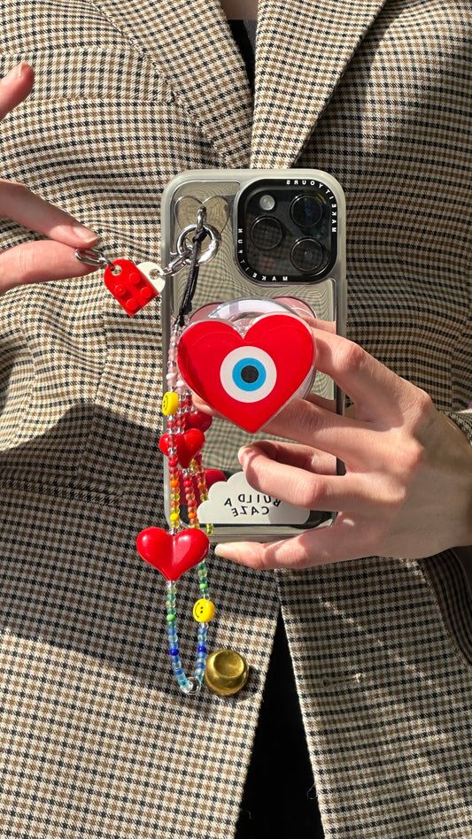 Protective heart magsafe pop holder, cute heart shaped magnetic pop socket and phone grip accessory for mobile devices.