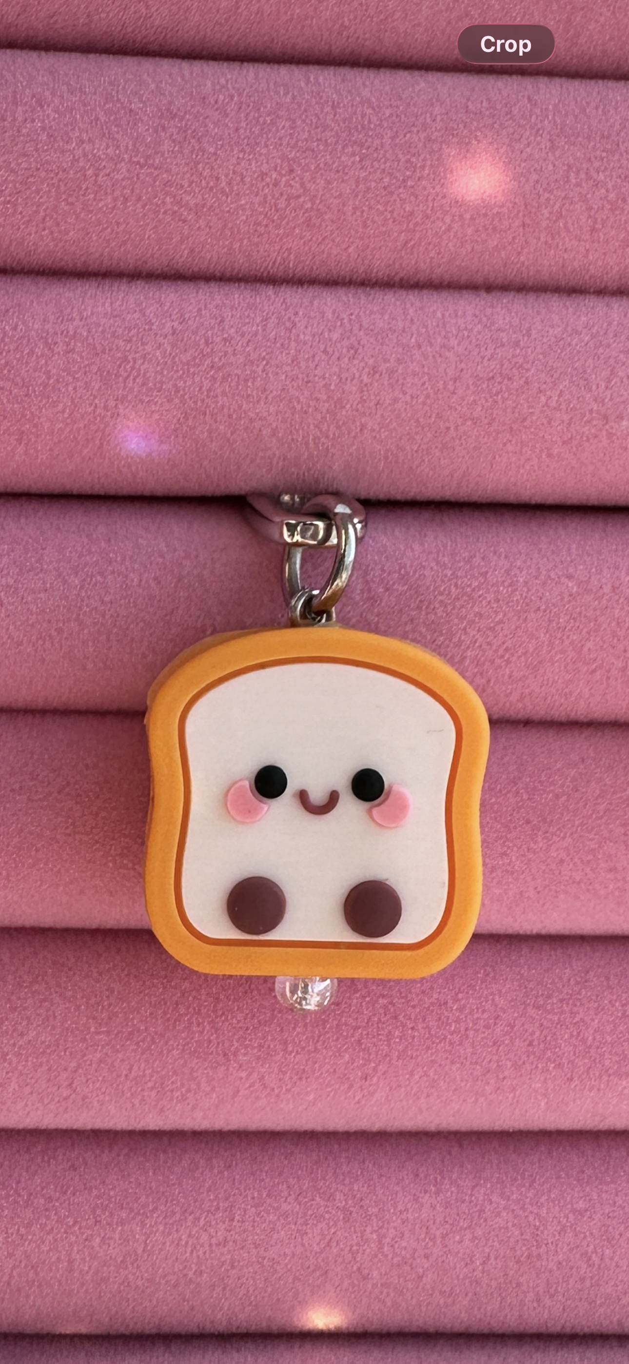Cute bestie toast phone charm with a smiling face, nostalgic Y2K aesthetic mobile accessory and decorative tech strap by Build a Caze.