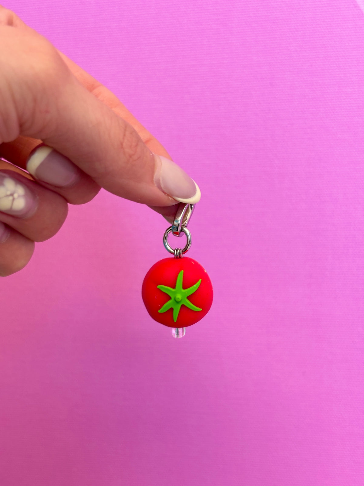 Cute red tomato phone charm with a 3D vegetable design, quirky food-themed mobile accessory for a nostalgic Y2K mirror selfie aesthetic by Build a Caze.