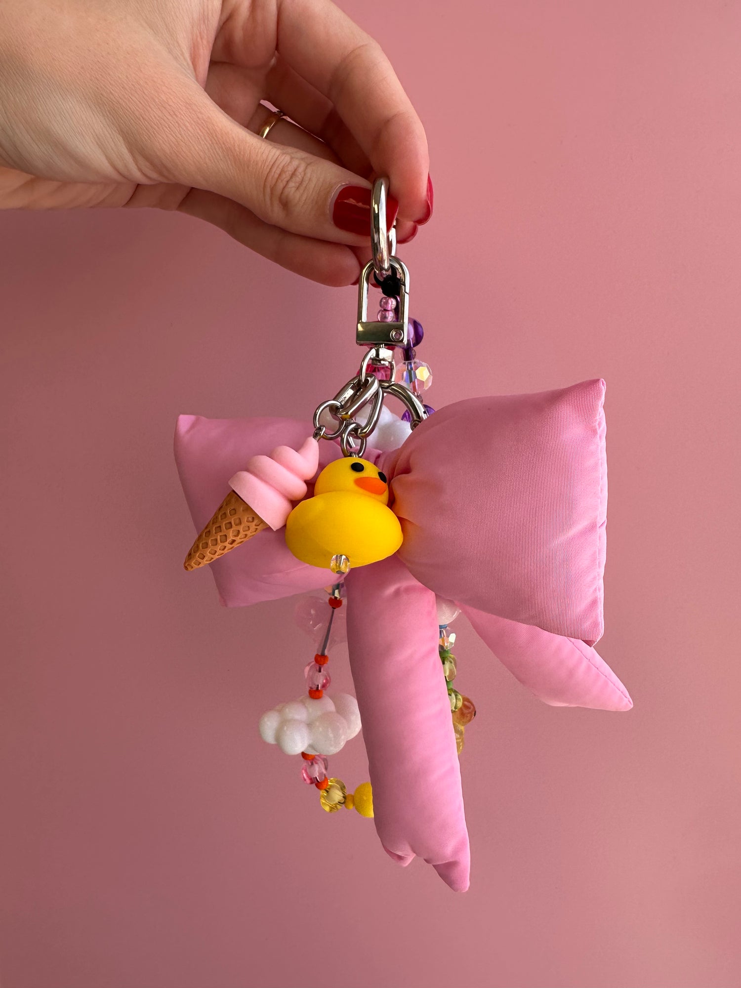 Adorable strawberry ice cream scoop phone charm, cute pink 3D food accessory for mobile cases and Y2K aesthetic tech decoration by Build a Caze.