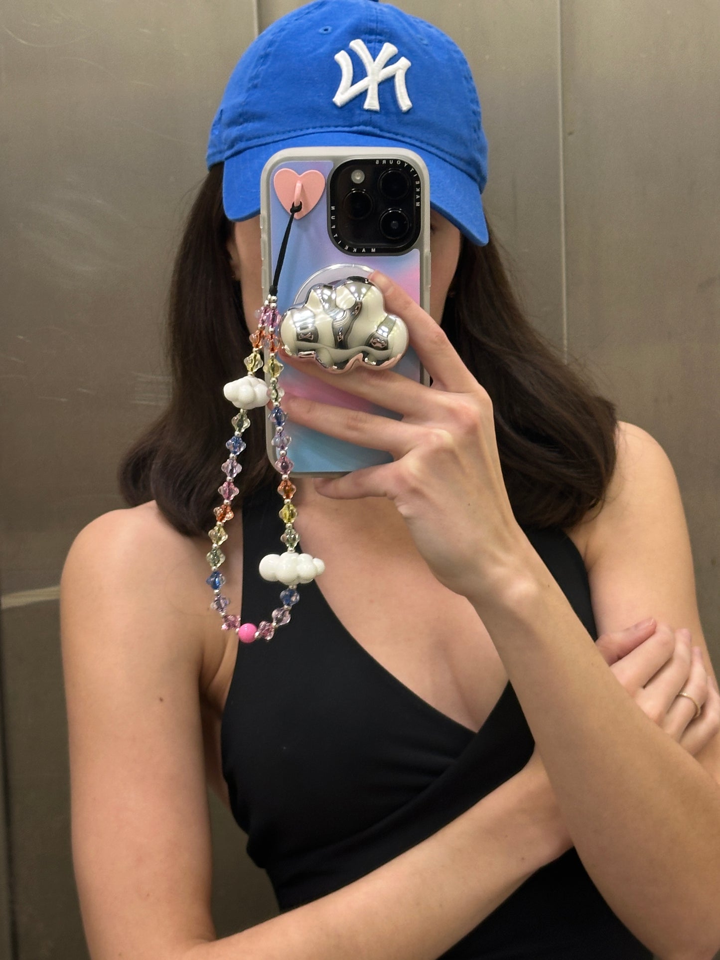 Colorful beaded phone wrist strap featuring translucent rainbow beads and white cloud charms on a black cord lanyard, perfect as a decorative phone strap and mobile phone accessory.