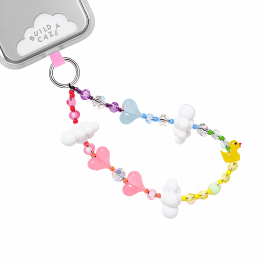 Phone strap attached to phone case. Colorful phone strap with beads of hearts, clouds and a duck.