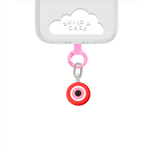Deep red evil eye phone charm with a chic and mysterious aesthetic, protective nazar amulet mobile accessory and trendy Y2K style tech strap by Build a Caze.
