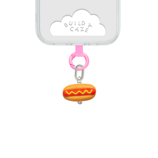 Mini hot dog 3D phone charm with mustard detail, fun food-themed Charmie accessory.