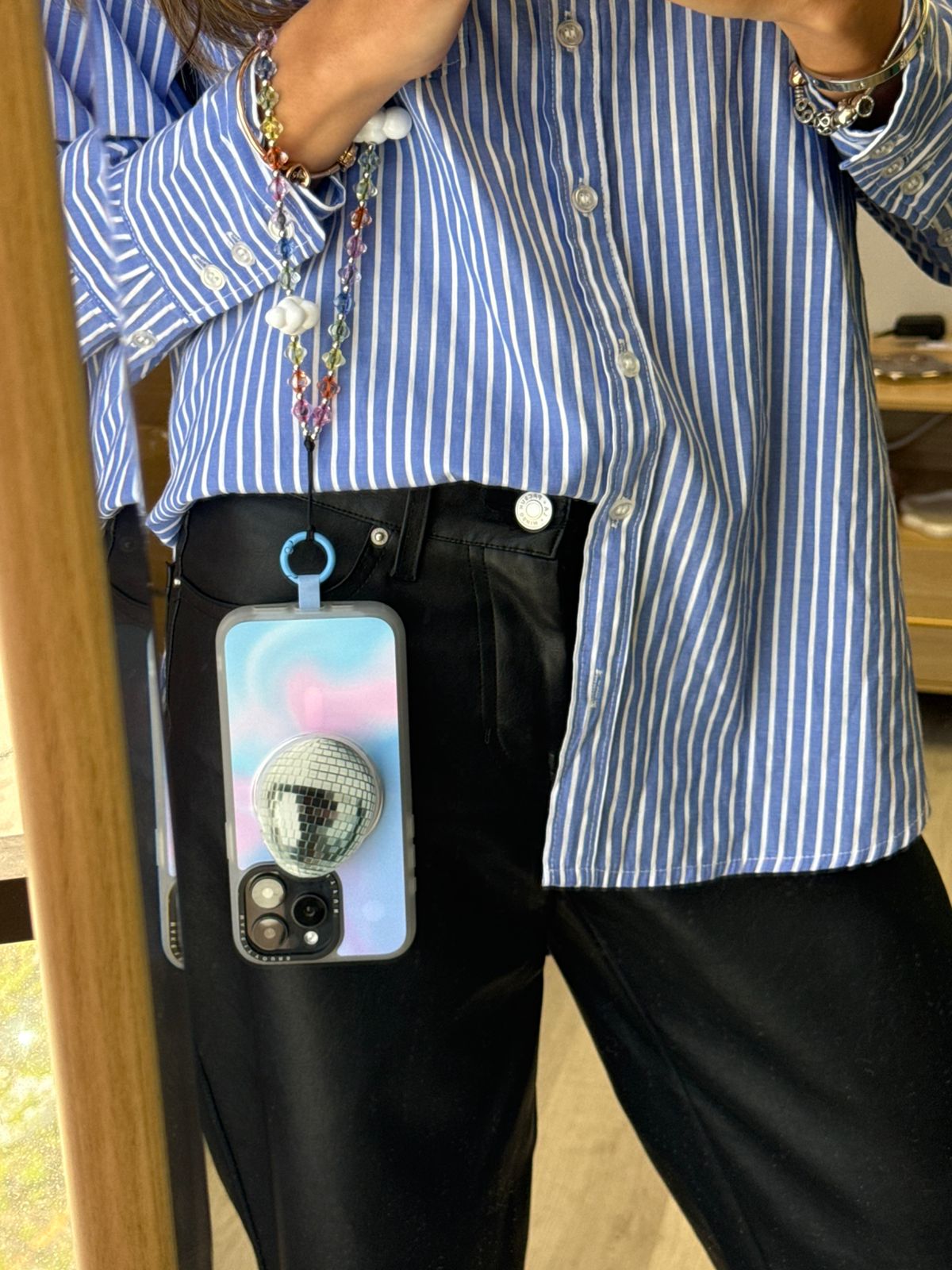 Beaded phone wrist strap featuring translucent colorful rainbow beads, white cloud charms, and a black cord lanyard, perfect as a decorative phone strap and mobile phone accessory.