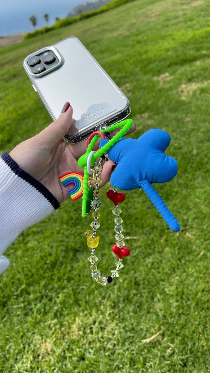 Beaded Pop Holder phone case accessory, colorful charm for mobile devices, stylish phone strap with beads, aesthetic phone grip attachment, trendy tech accessory.