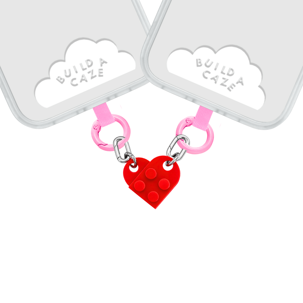 Red and pink heart-shaped phone charm with a Buildin' Love theme, cute Y2K aesthetic mobile accessory and decorative tech strap for phone cases by Build a Caze.