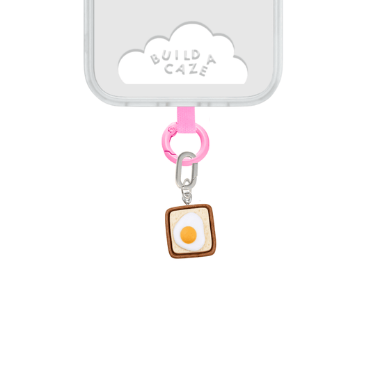 White and brown Eggie Toast Bites Charmie charm and dangly accessory shown against a plain background - Build A Caze