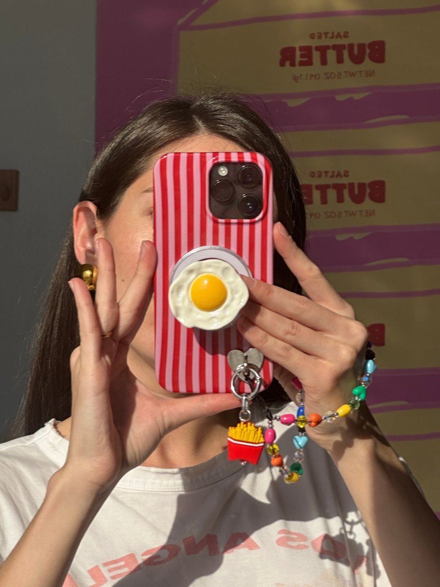 Sunny side up fried egg design phone charm, cute 3D food-themed MagSafe accessory.