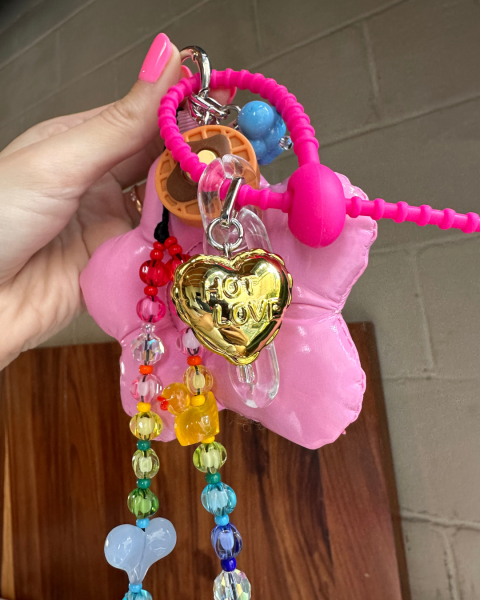 Shiny gold heart-shaped balloon phone charm, 3D metallic love-themed mobile accessory for phone cases, trendy Y2K aesthetic hanging tech strap by Build a Caze.