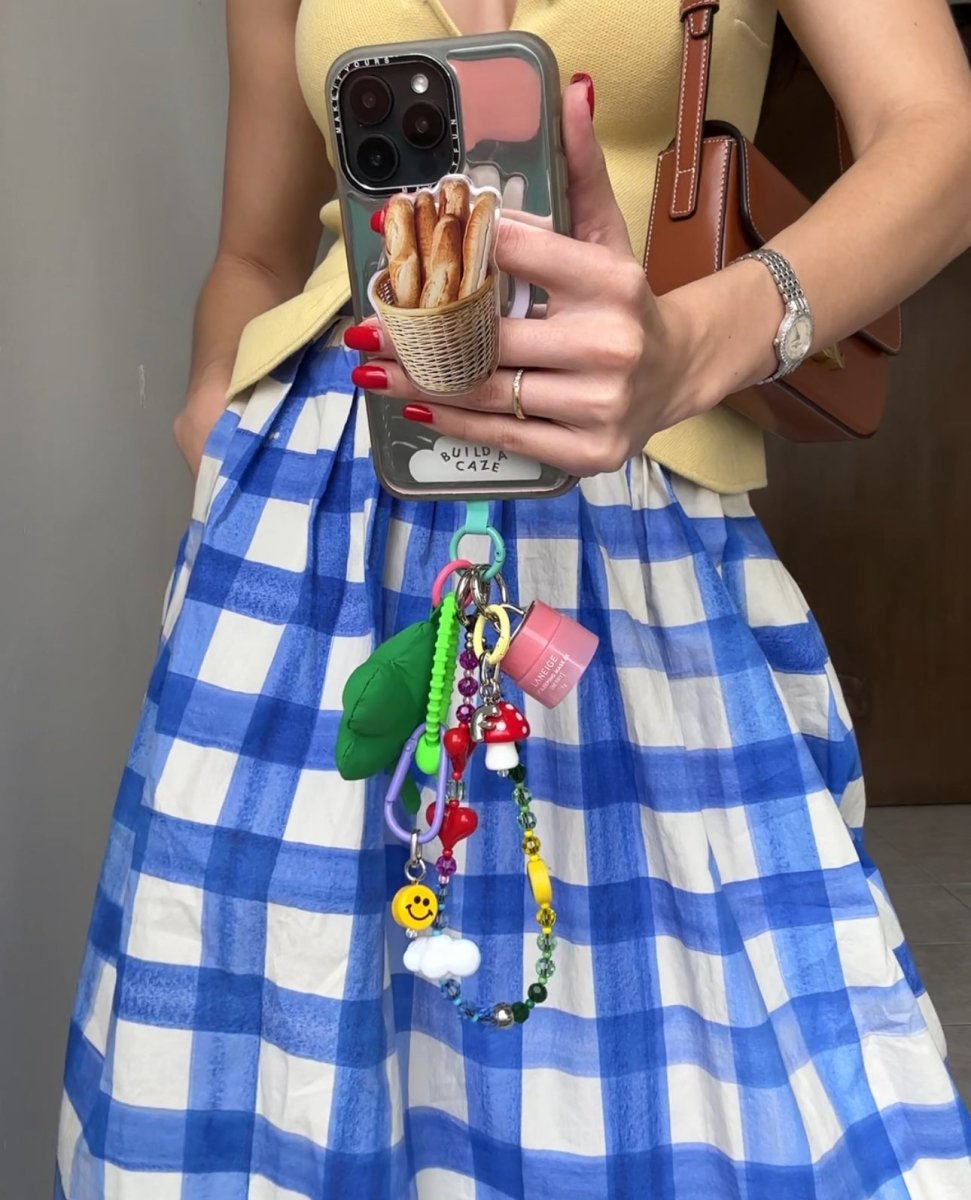 Beaded phone wrist strap featuring vibrant red heart-shaped beads and a black cord lanyard, perfect as a decorative phone strap and mobile phone accessory for your phone case.