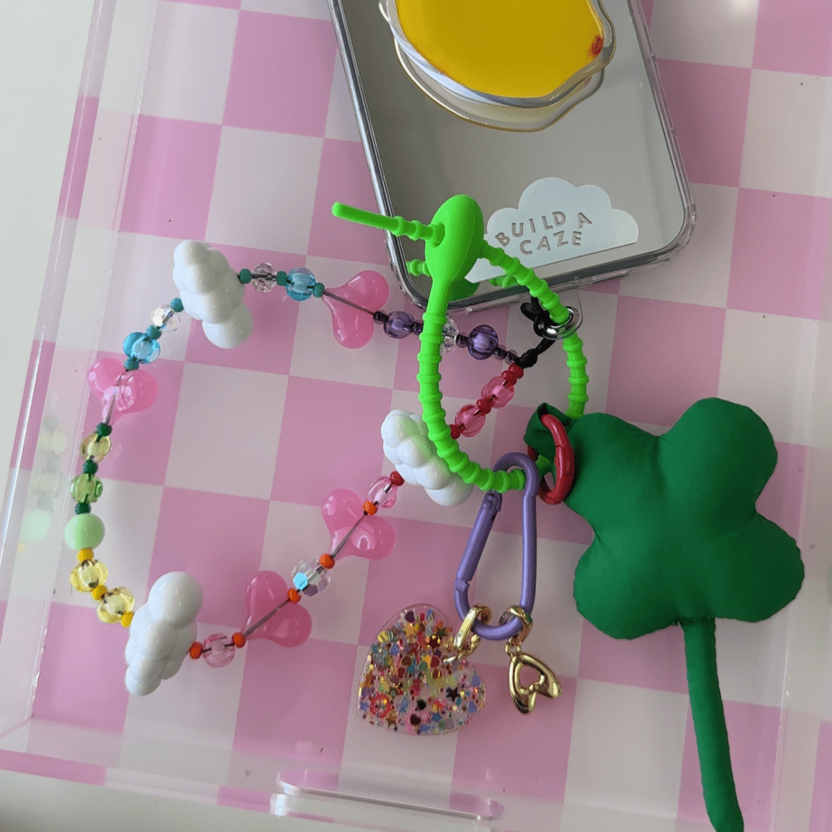Blue Clover Me keychain charm for phone cases and bags, aesthetic four leaf clover mobile accessory, cute blue floral bag charm, trendy phone strap attachment.