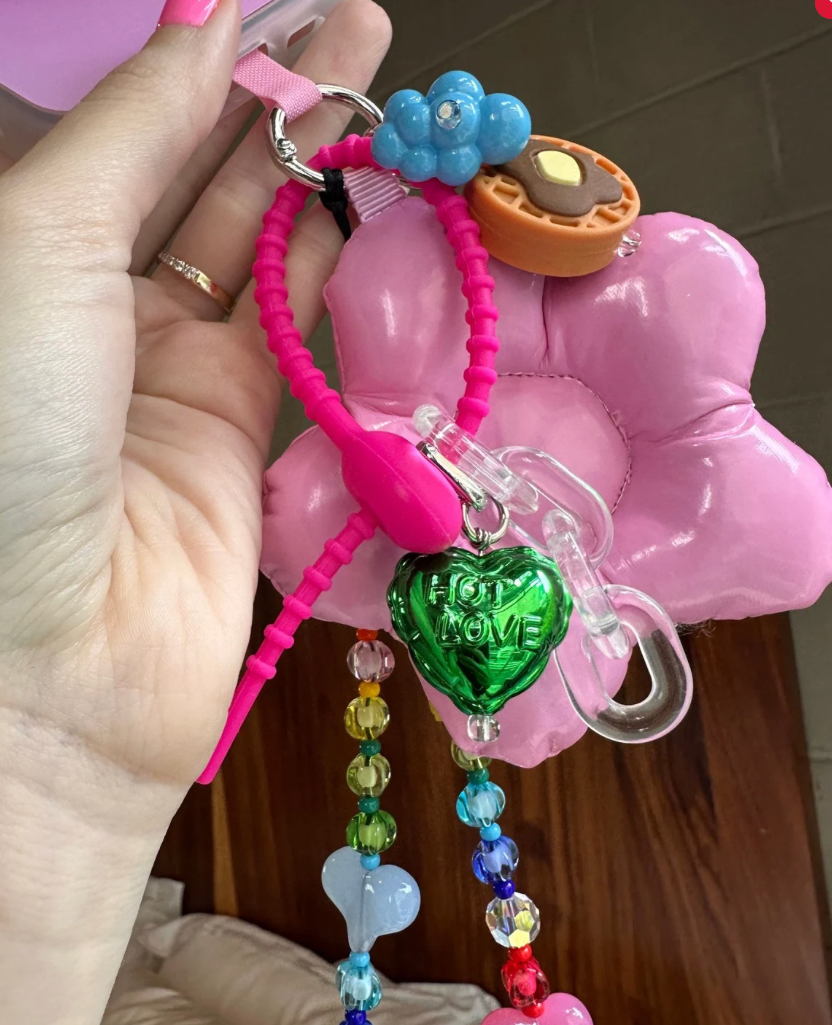 Green hot air balloon phone charm with a gold heart and yellow accents, cute Y2K aesthetic mobile accessory for phone cases and mirror selfies by Build a Caze.
