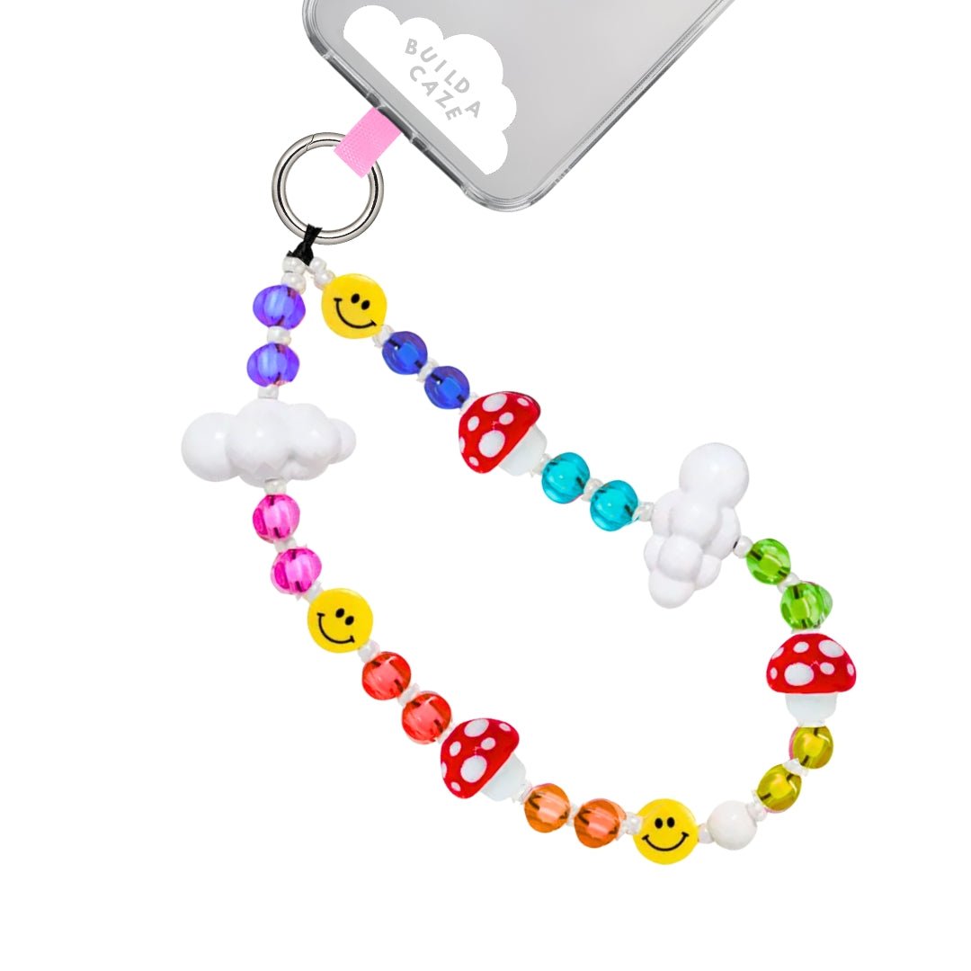 Phone wrist strap multicolor rainbow beads, red mushroom charms, smiley faces, and white clouds cell Phone Build A Caze