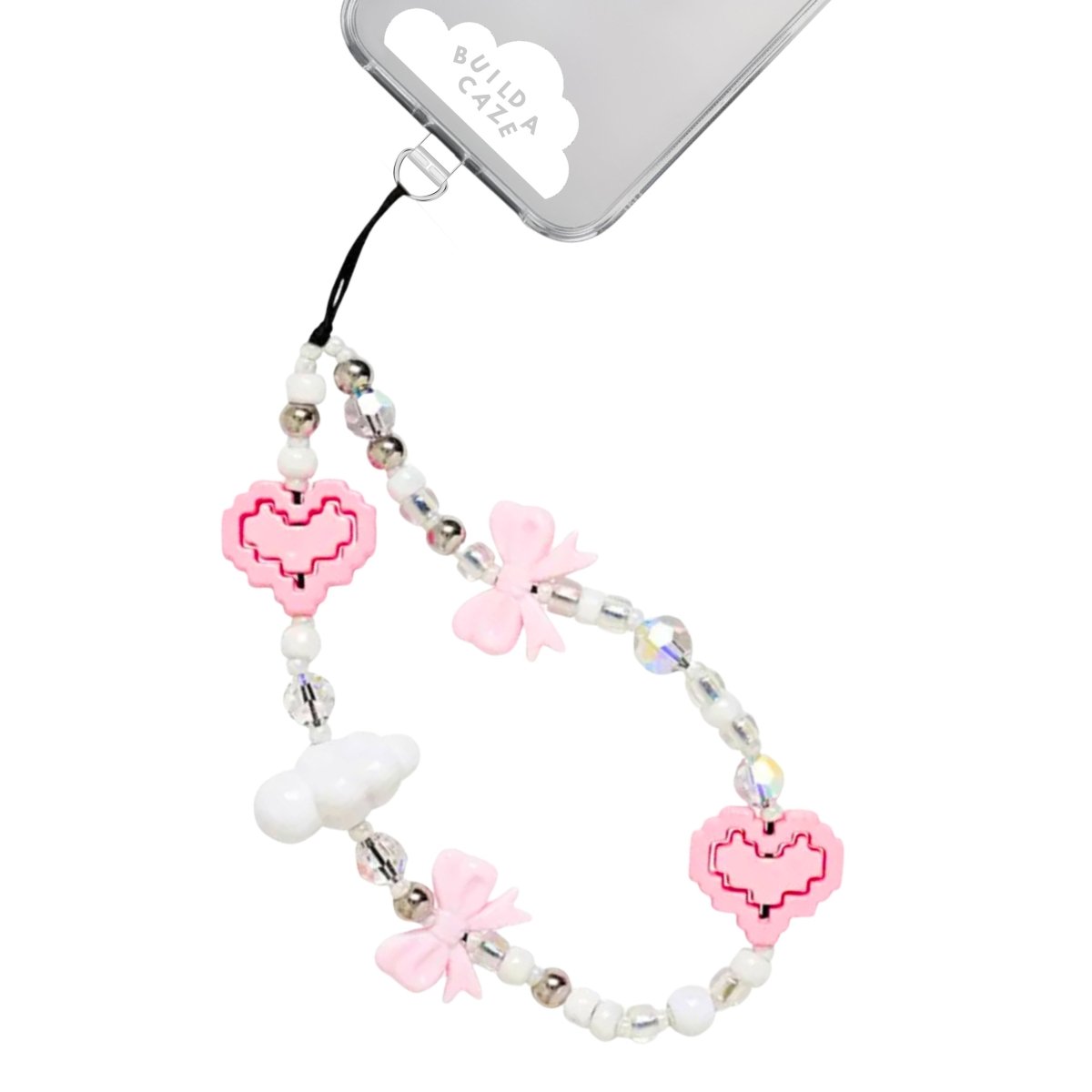 Beaded phone wrist strap featuring a coquette aesthetic with pink, white, and clear beads, heart and cloud charms, and a pink bow, attached to a black cord lanyard as a stylish phone strap accessory.