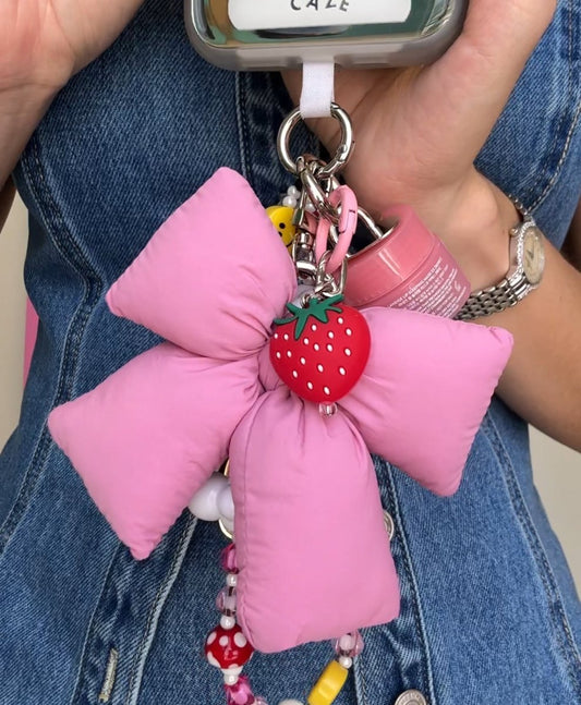 Knoty-Bow Puffy Keychain in baby pink, soft handmade ribbon bow bag charm, cute puffy fabric accessory for phone cases and backpacks, coquette aesthetic keychain, lightweight pink bow charm for handbags.