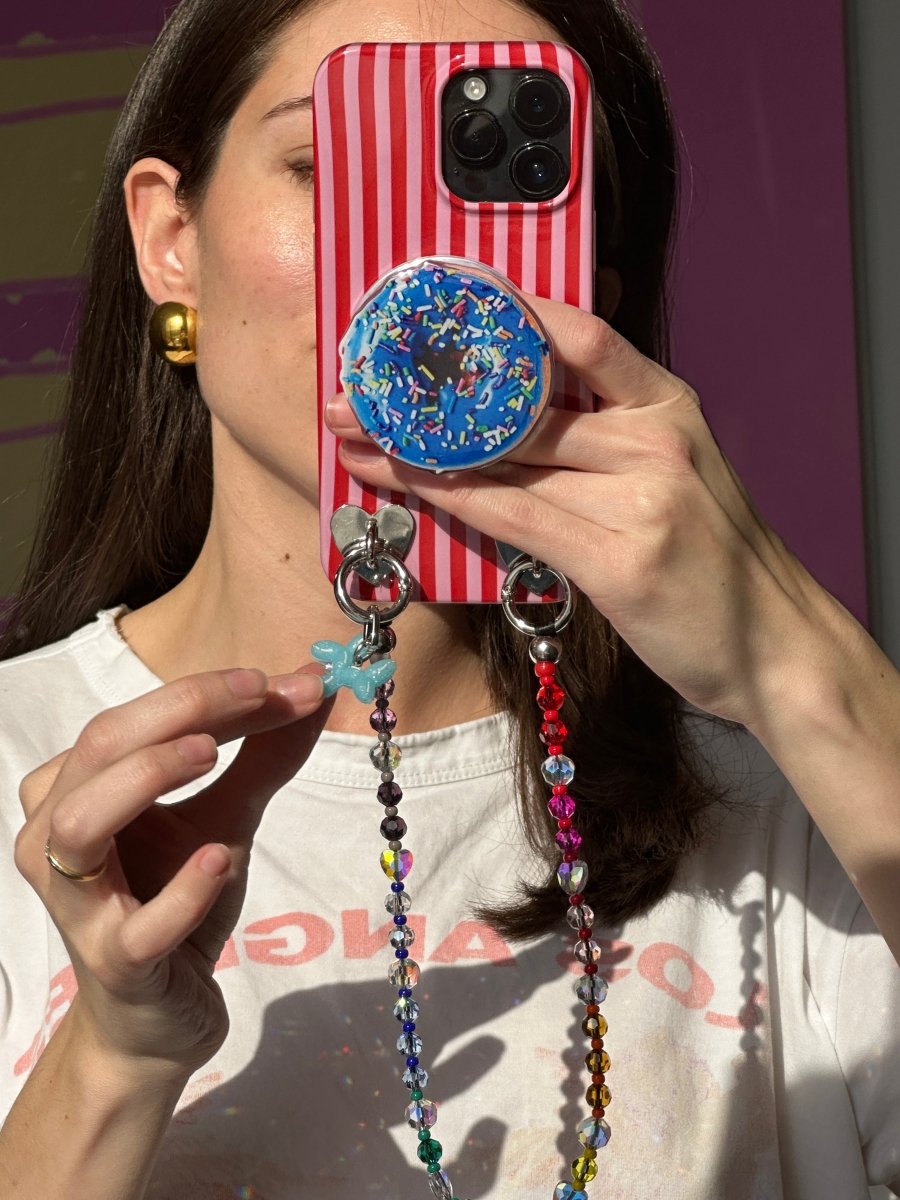 Stylish light blue bubble bark phone charm featuring a playful textured design, trendy Y2K aesthetic mobile strap accessory by Build a Caze.