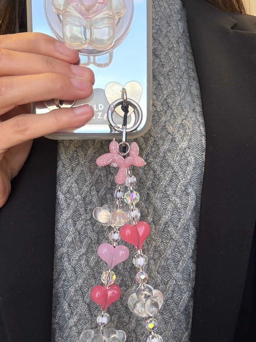 Light pink Bubble Bark Charmie phone charm featuring a textured bubble design, cute Y2K aesthetic mobile accessory and decorative tech strap for phone cases by Build a Caze.