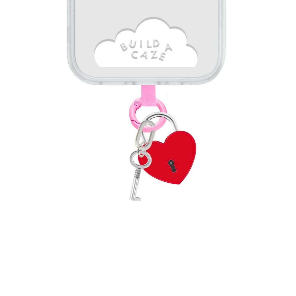 Bold red heart lock phone charm with a padlock design, trendy Y2K aesthetic mobile accessory and decorative tech strap by Build a Caze.