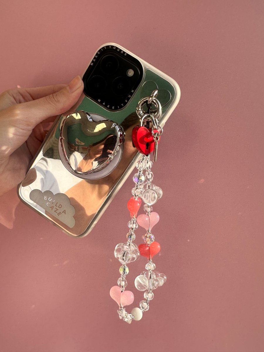 Beaded phone wrist strap featuring sparkling iridescent beads and a black cord lanyard, designed as a decorative phone strap and mobile phone accessory for a stylish wrist strap look.