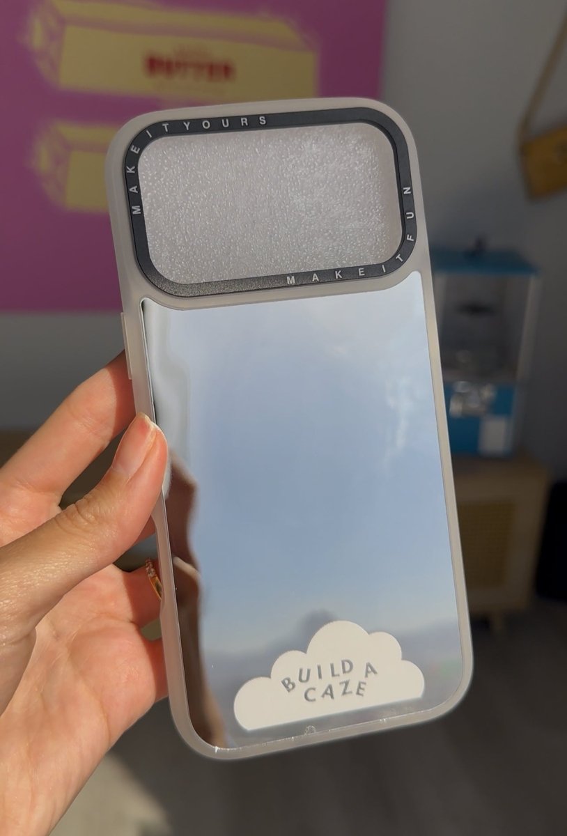 Silver Magsafe mirror phone case for iPhone 17 featuring a reflective back cover, magnetic charging compatibility, and heavy duty 10ft drop protection.