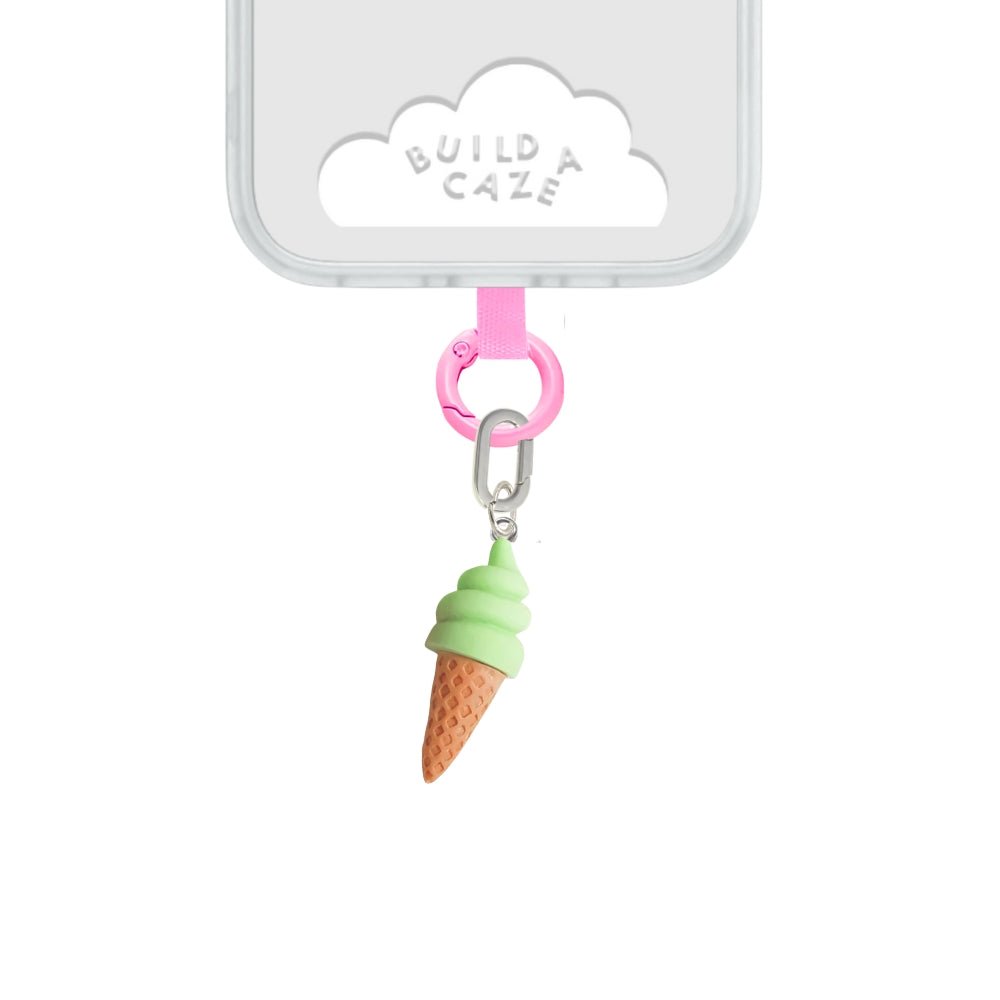 Cute matcha ice cream scoop phone charm with a green and brown swirl design, trendy Y2K aesthetic mobile accessory and decorative tech strap by Build a Caze.