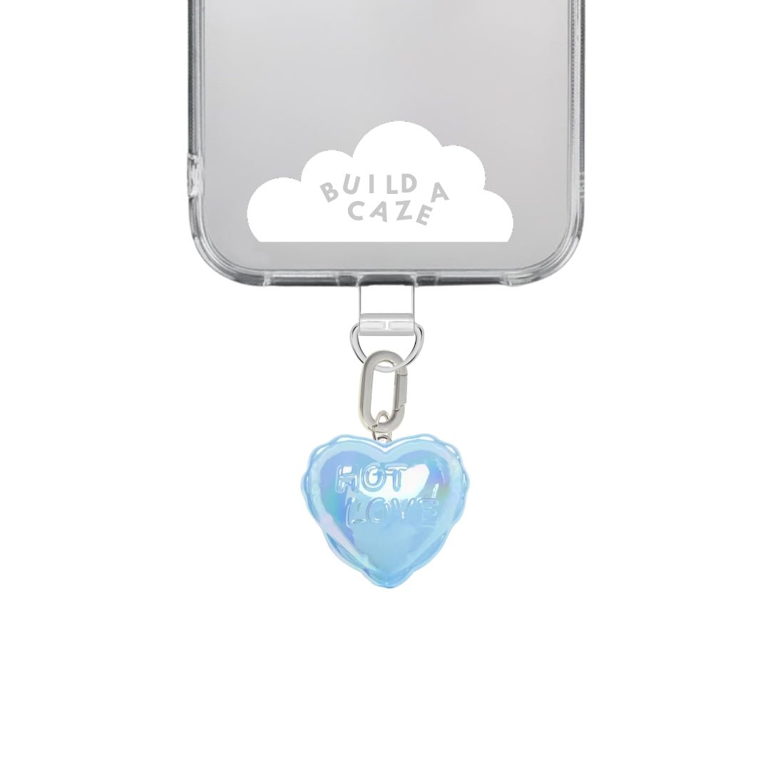 Pastel blue heart-shaped balloon phone charm with a quirky 3D design, cute Y2K aesthetic mobile accessory and decorative tech strap for phone cases by Build a Caze.