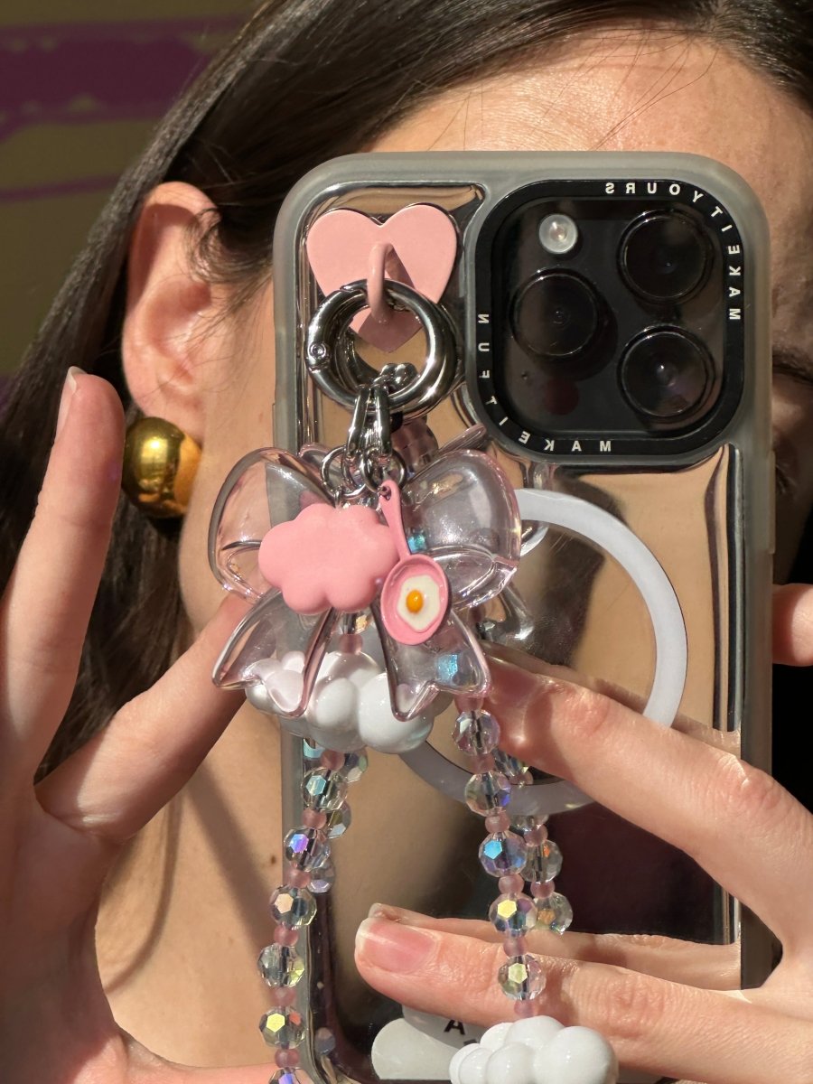 Phone wrist strap iridescent pink gummy bows and cloud charms Build A Caze