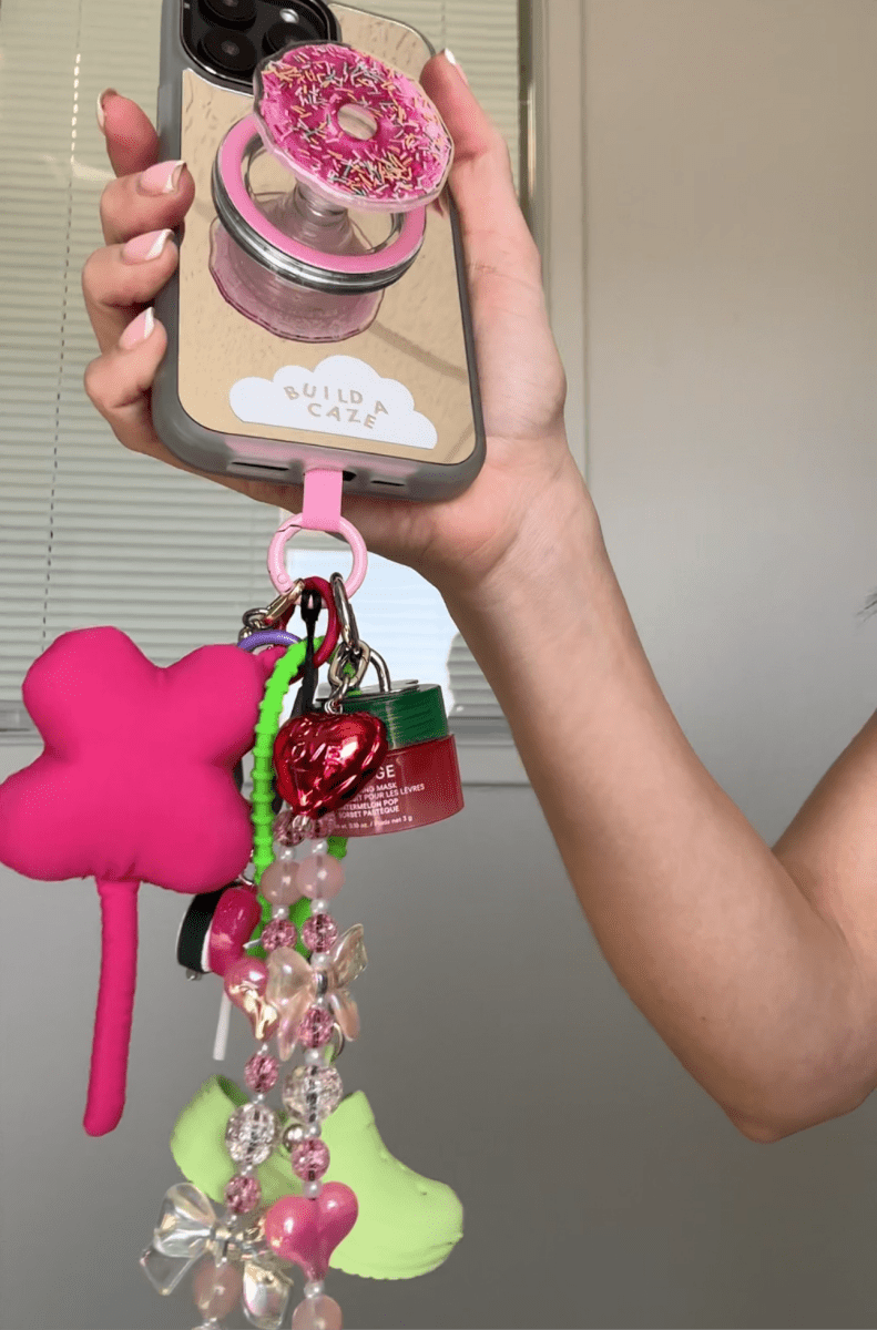 Pink Clover Me keychain, cute floral four-leaf clover charm for phone cases and bags, trendy lucky charm mobile accessory, aesthetic pink flower keychain attachment.