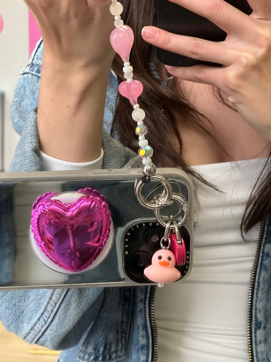Pink heart balloon phone charm, cute 3D heart-shaped MagSafe accessory.