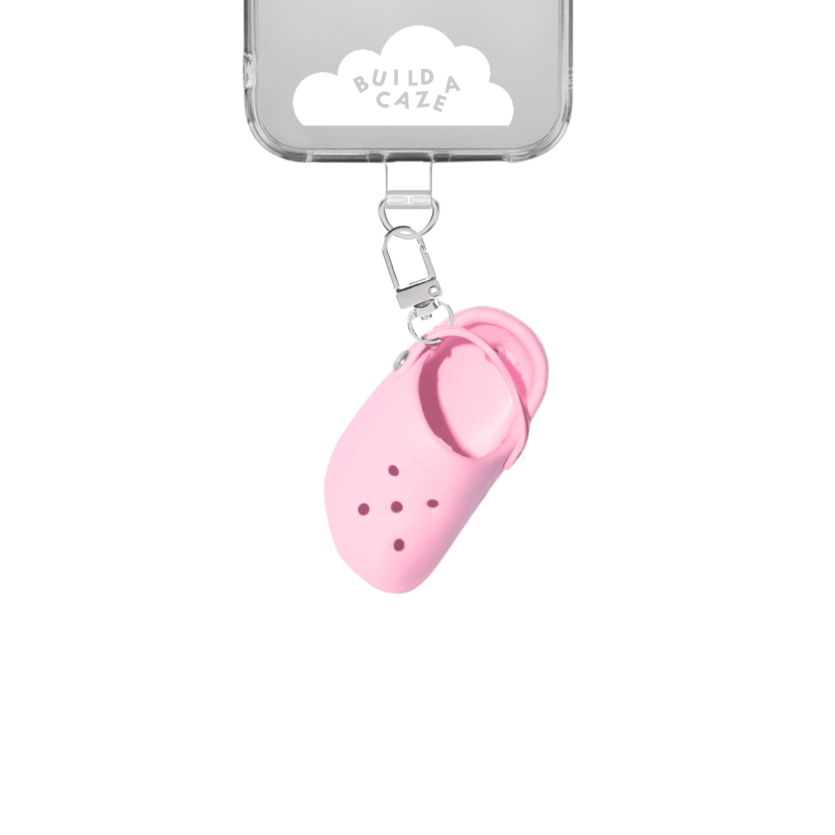 Pink little sandal keychain, quirky croc-style shoe charm for phone cases and bags, miniature footwear accessory with shoelace design, trendy pink sandal attachment for mobile device styling.