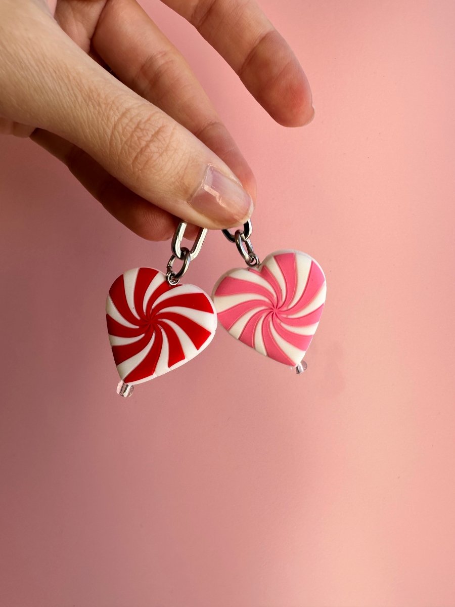 Pink sugar swirl phone charm with a marbled candy aesthetic, cute Y2K decorative mobile strap and trendy phone case accessory by Build a Caze.
