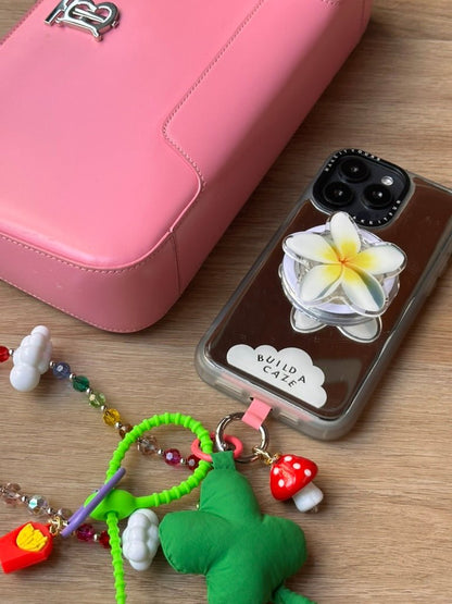 Plummie Baby cute purple plum character MagSafe pop holder, whimsical fruit inspired magnetic pop socket and phone grip accessory.