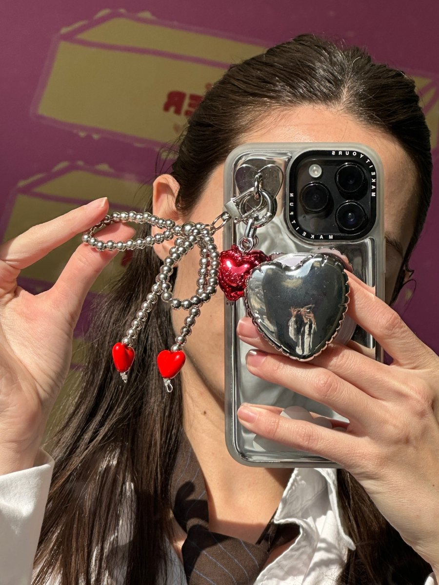 Pretty Tied Up purple bow keychain with heart details, cute charm for phone cases and bags, stylish mobile phone accessory, purple and white bow pendant for backpacks and keys.