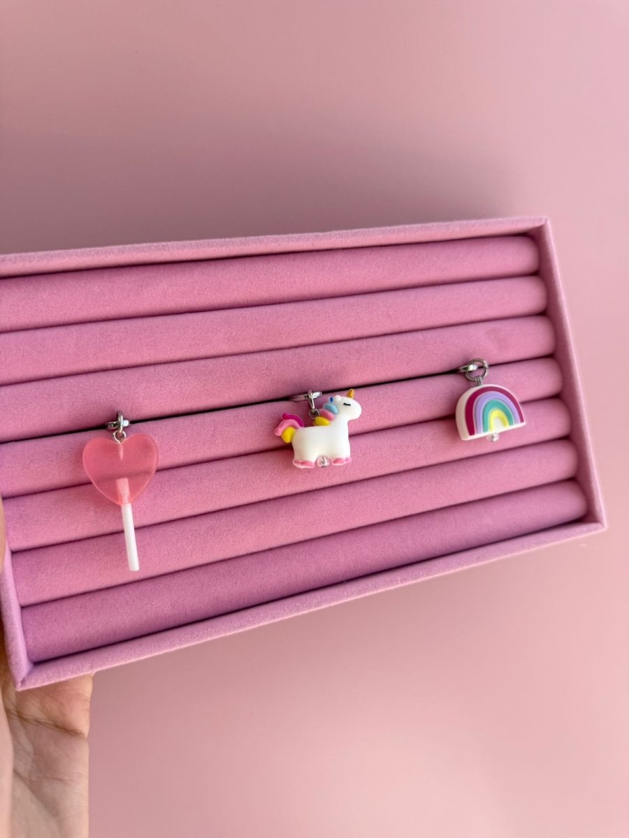 Multicolor-rainbow Rainbow Dreamie Charmie charm and dangly accessory shown against a plain background - Build A Caze