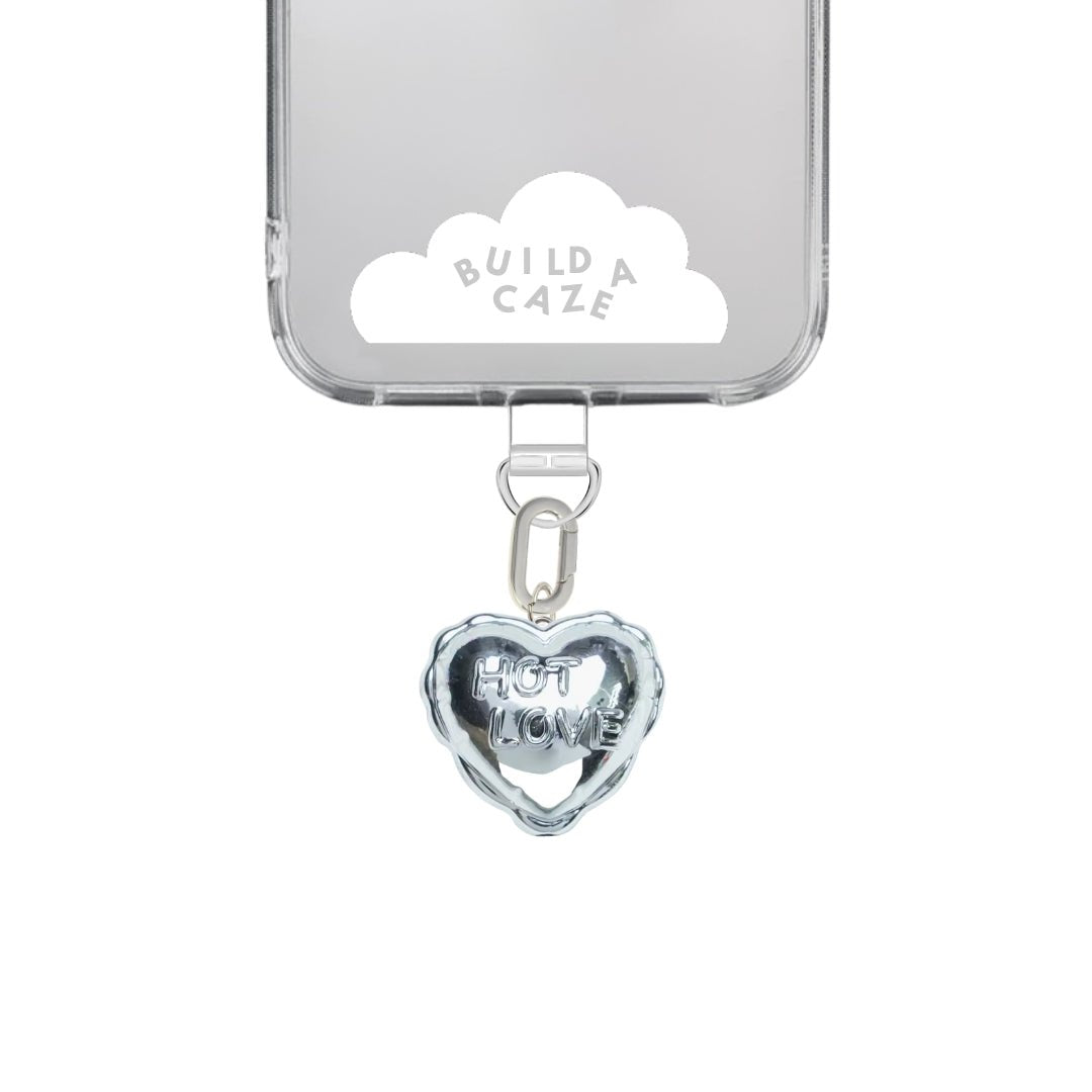 Silver heart-shaped balloon phone charm with a metallic finish, cute Y2K aesthetic mobile accessory and decorative tech strap for phone cases by Build a Caze.