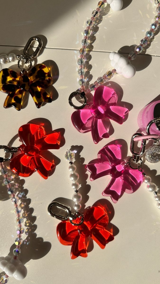 Hot Pink Baby Bow keychain, cute ribbon charm for phone cases and bags, coquette aesthetic mobile accessory, trendy pink bow attachment, stylish phone case charm.