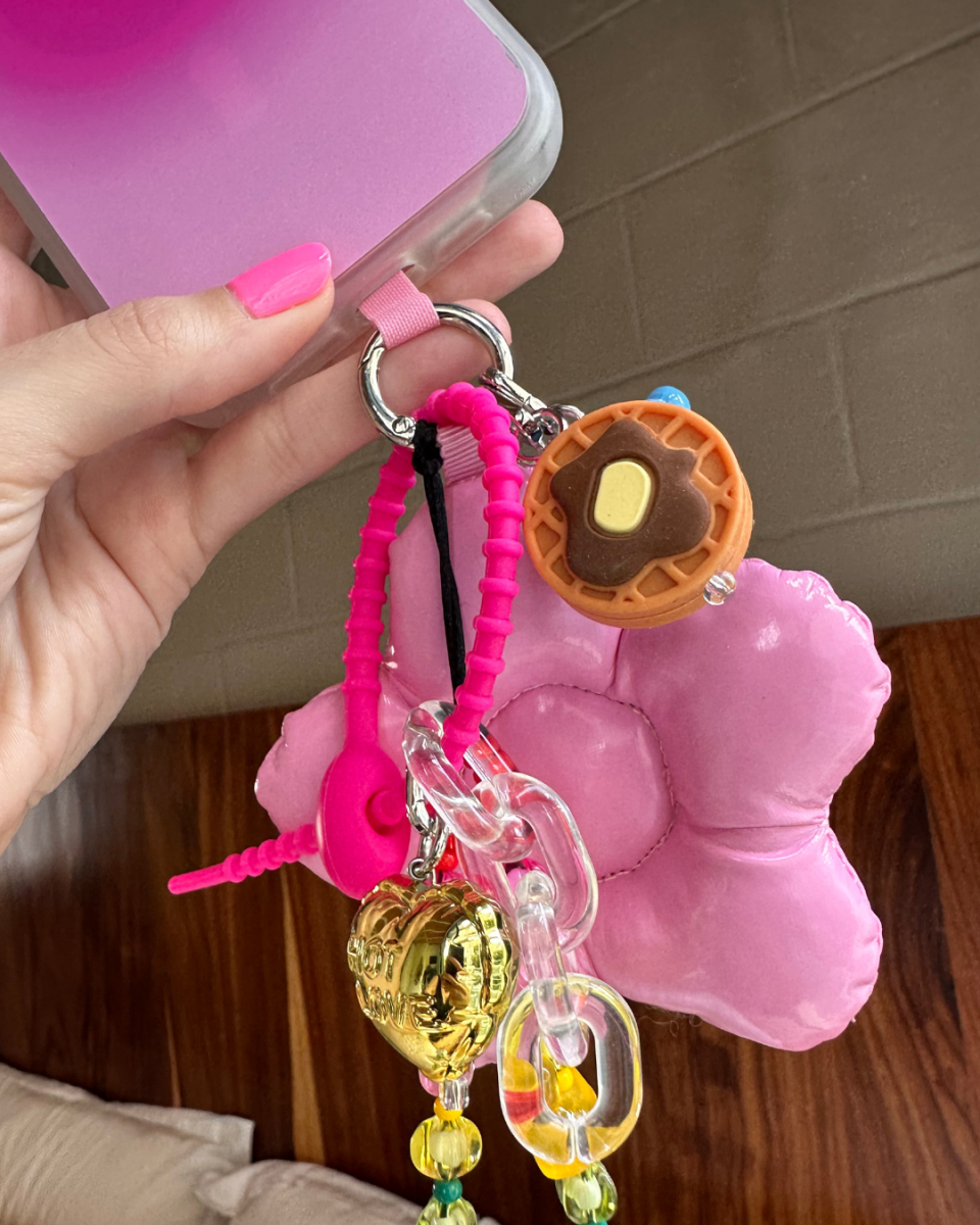 Cute 3D waffle phone charm with a realistic breakfast food design, golden syrup detail, and a nostalgic Y2K aesthetic, handmade mobile accessory and decorative tech strap by Build a Caze.